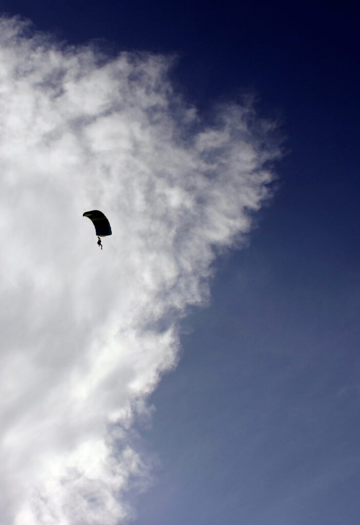 Skydiver in front of cloud